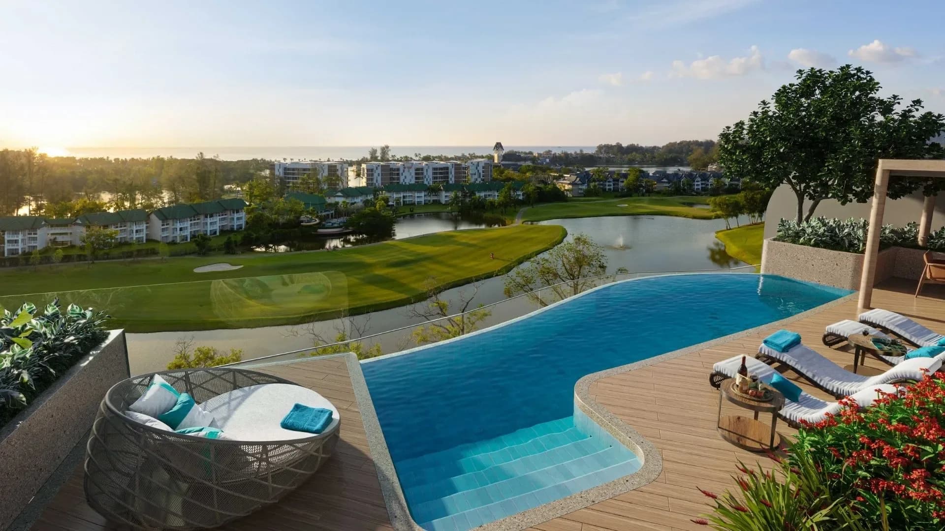 A penthouse rooftop: private pool, deck and daybed above the lagoon and the golf course